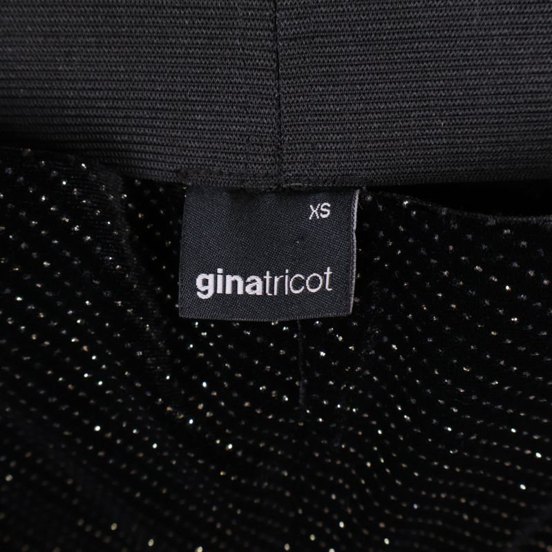 Varumärkesetikett gina tricot