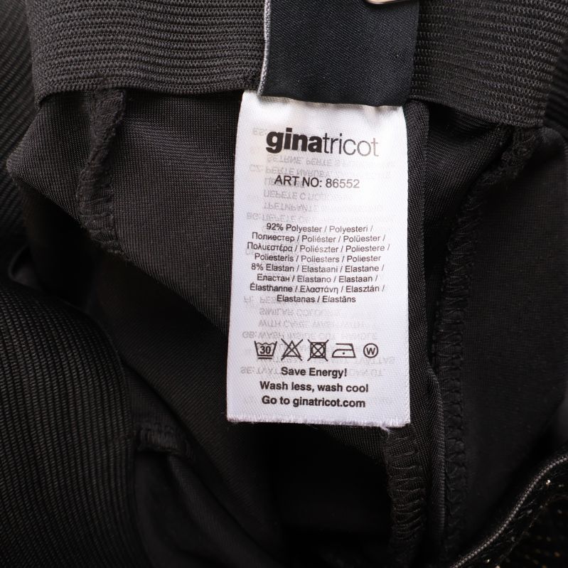 Etikett med materialinformation och tvättråd