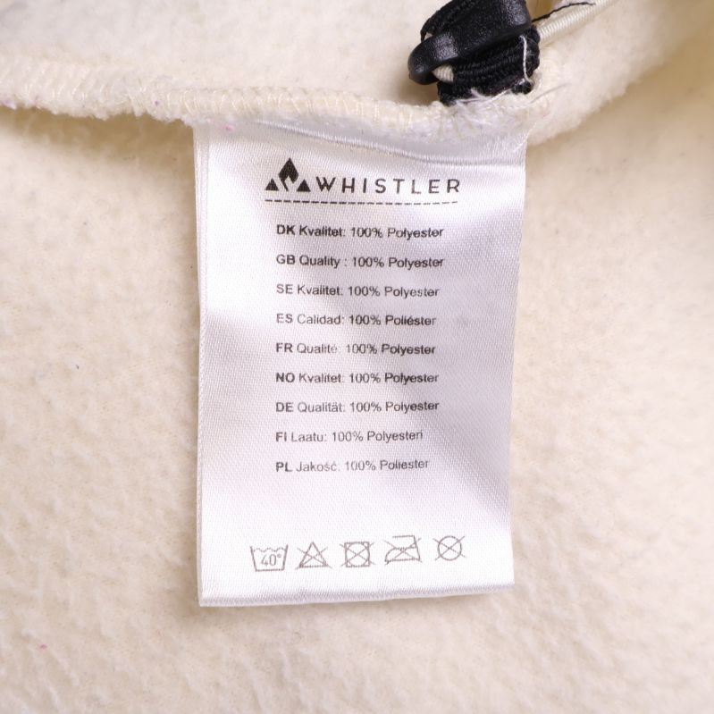 Materiallapp med tekst Whistler och 100% polyester