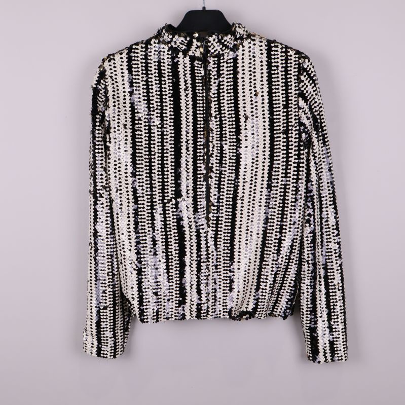 Paljettblus med svarta och vita ränder bakifrån