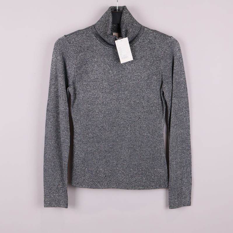 Glittrig silverfärgad polotröja med lång ärm framifrån