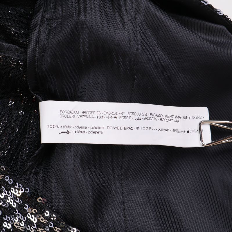 Materiallapp med innehållsförteckning för byxorna