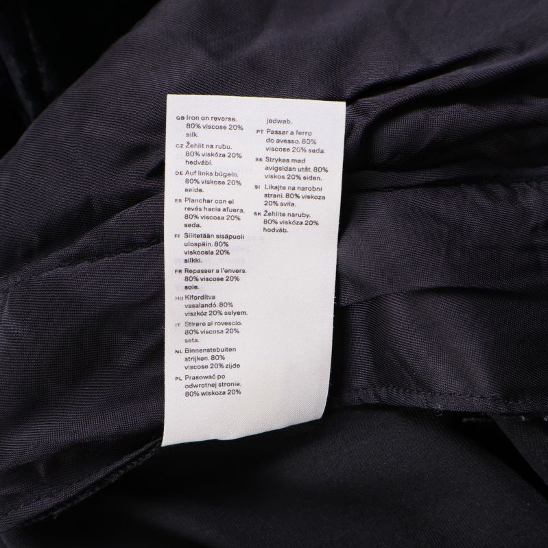 Materiallapp med detaljerad sammansättning och skötselråd