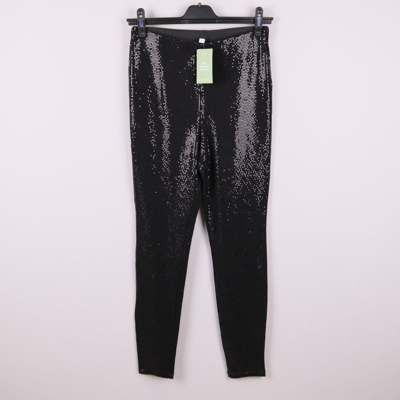 Svarta glittertights med paljetter framifrån på galge