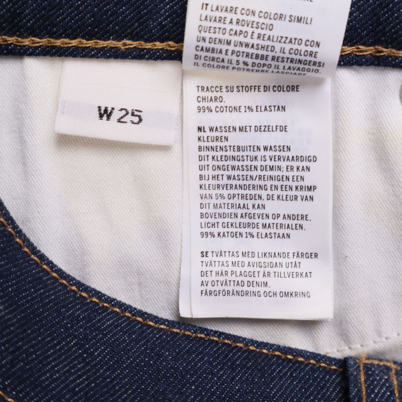 Materialetikett med 99 procent bomull och 1 procent elastan