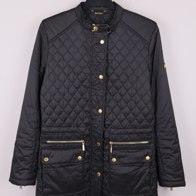 Framficka med gulddetaljer och dragkedjor