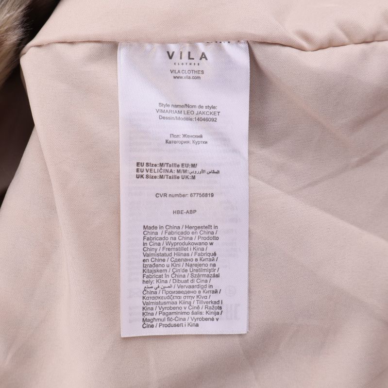 VIT etikett med information om tillverkningsland och material