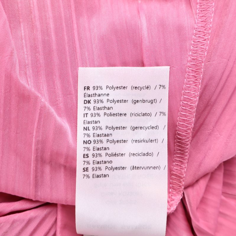 Materiallapp med information om polyester och elastan
