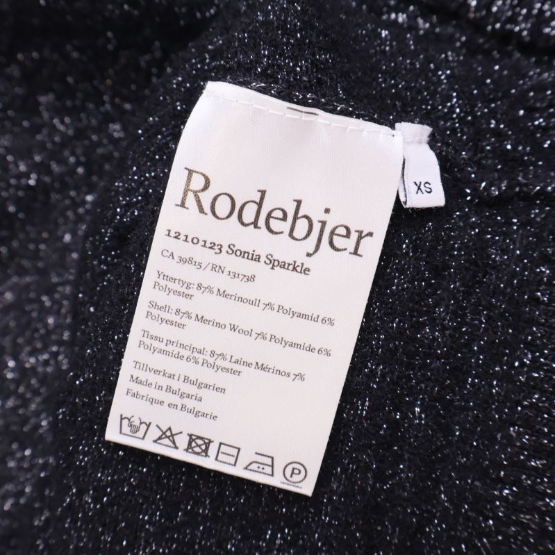 Materialetikett visar Rodebjer och sammansättning XS