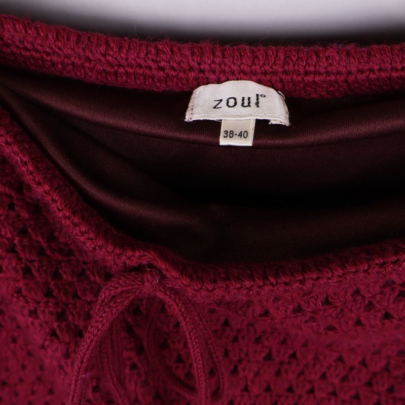 Etikett från Zoul visar stl 38-40 i kjolens midja