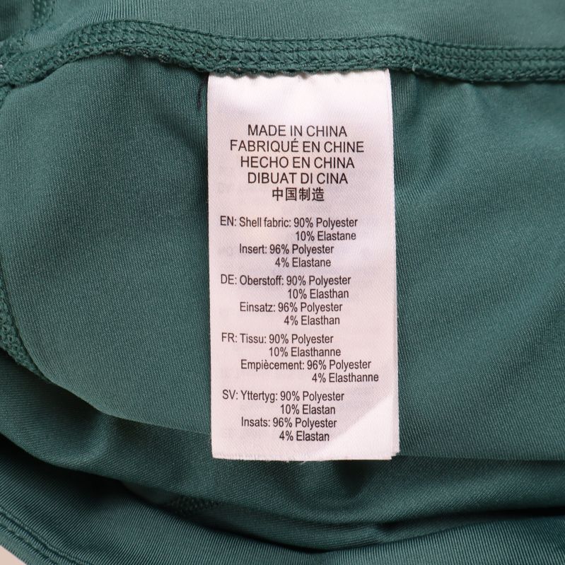 Materiallapp med information om polyester och elastan