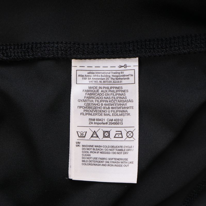 Tvättråd och materialetikett för Reebok tightsen