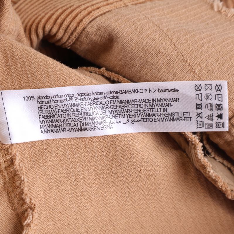 Materiallapp med information om 100% bomull