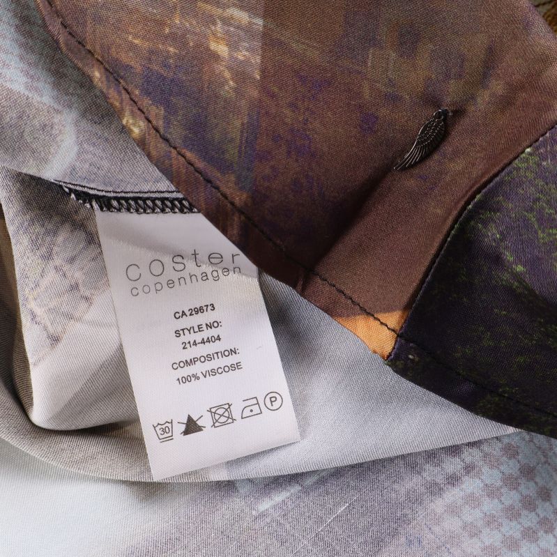 Tvättrådsetikett visar 100% viskos som material