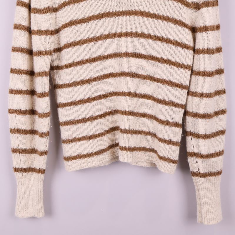 Nedre delen av stickad tröja och ärmmudd