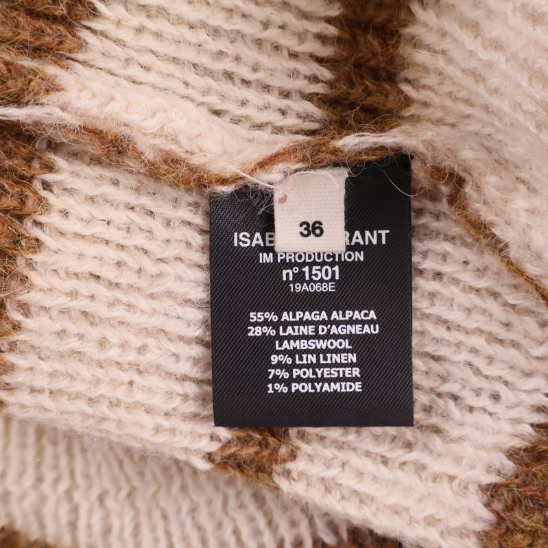 Materiallapp visar tröjans materialkomposition och storlek