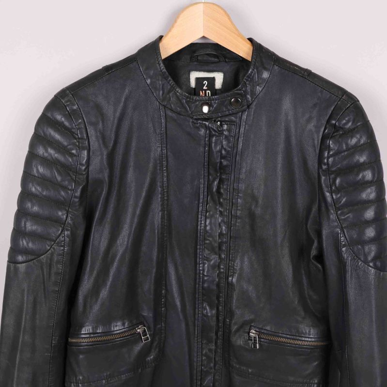 Storleksetikett EUR 38 och H&M logga