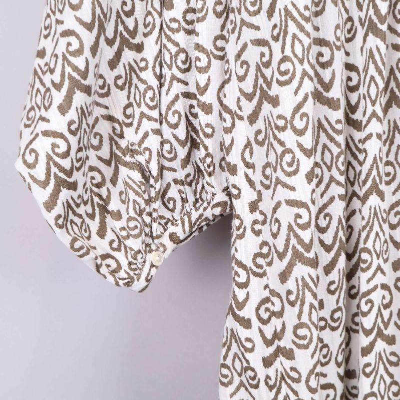 Ärm med knappdetalj