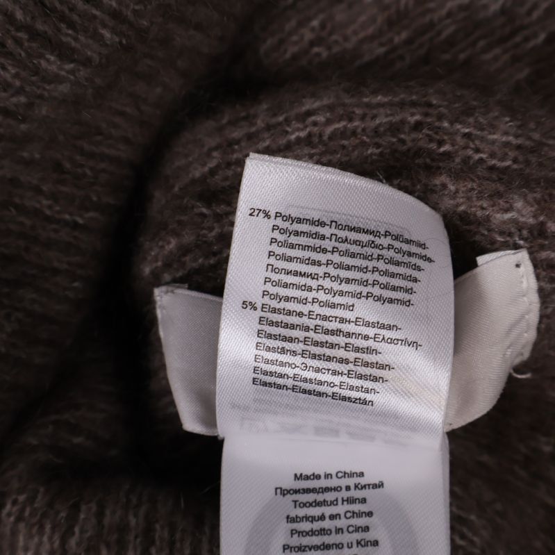 Materiallapp som visar polyamid, polyester och elastan