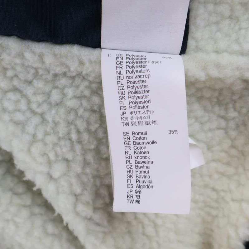 Materiallapp med information om bomull och polyester