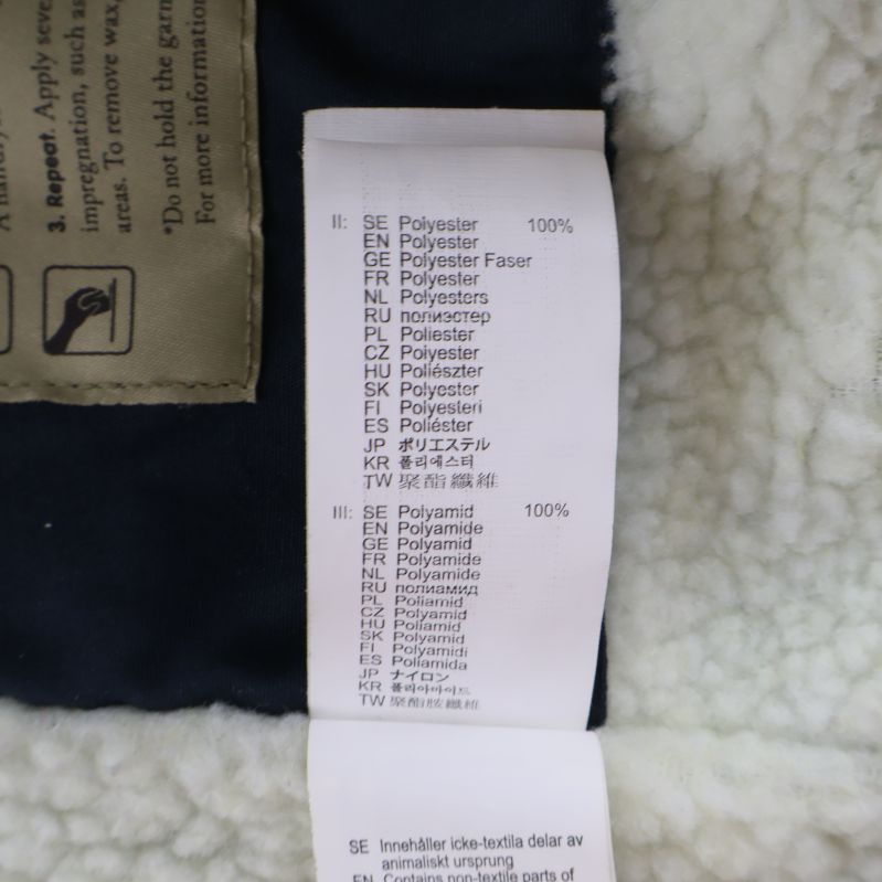 Materialetikett visar 100% polyamid och polyester