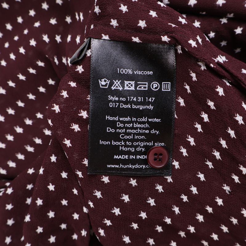 Materiallapp visar 100% viskos och tvättråd