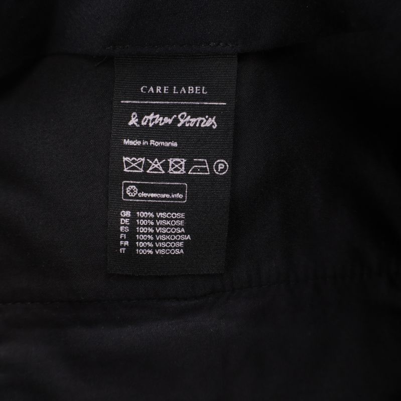 Materialetikett som visar 100 procent viskos