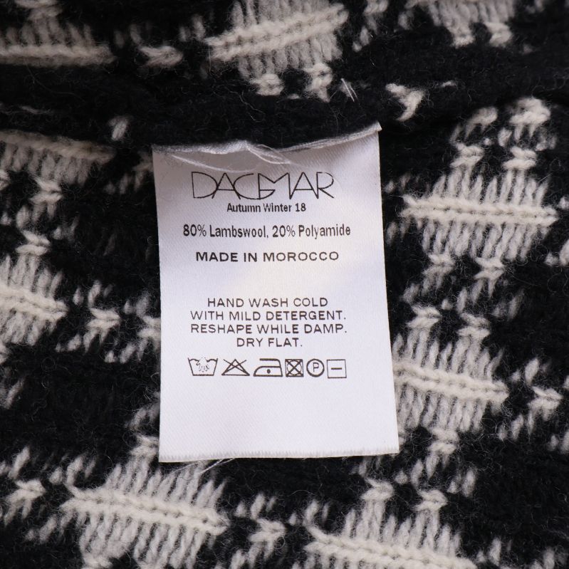 Materialetikett med 80% lammull och 20% polyamid