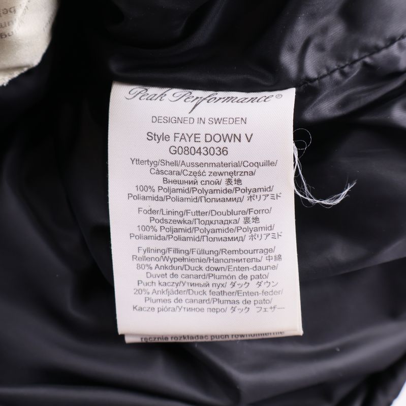 Materiallapp med information om dun och polyester i väst