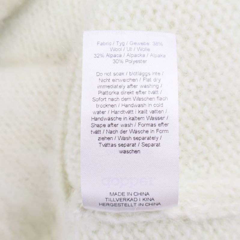 Materialinformation: 38% ull, 32% alpacka, 30% polyester