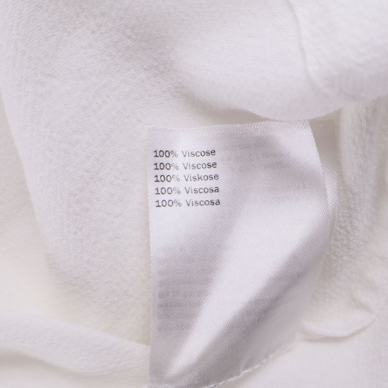 Materialetikett visar 100% viskos