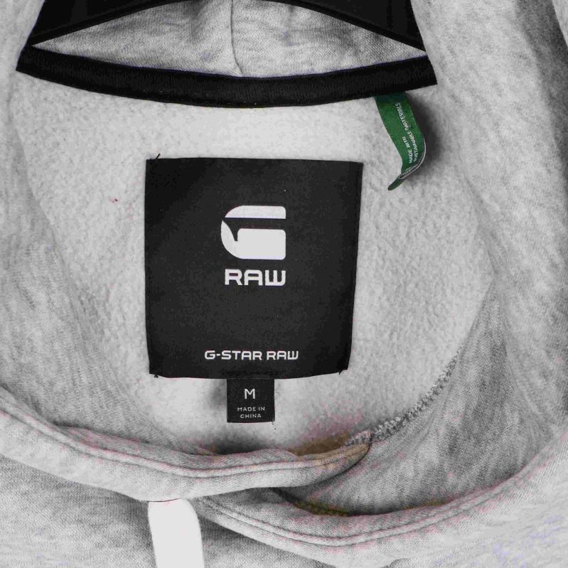 Detaljbild på G-Star Raw etikett i huva på hoodie