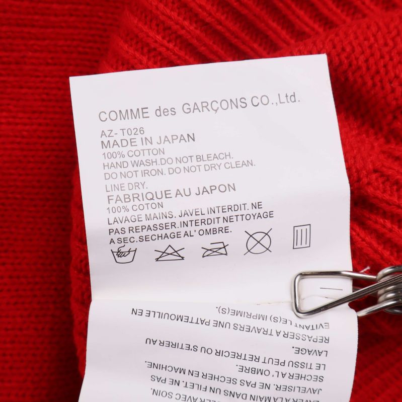 Material- och tvättetikett där det står 100% Cotton och Made in Japan