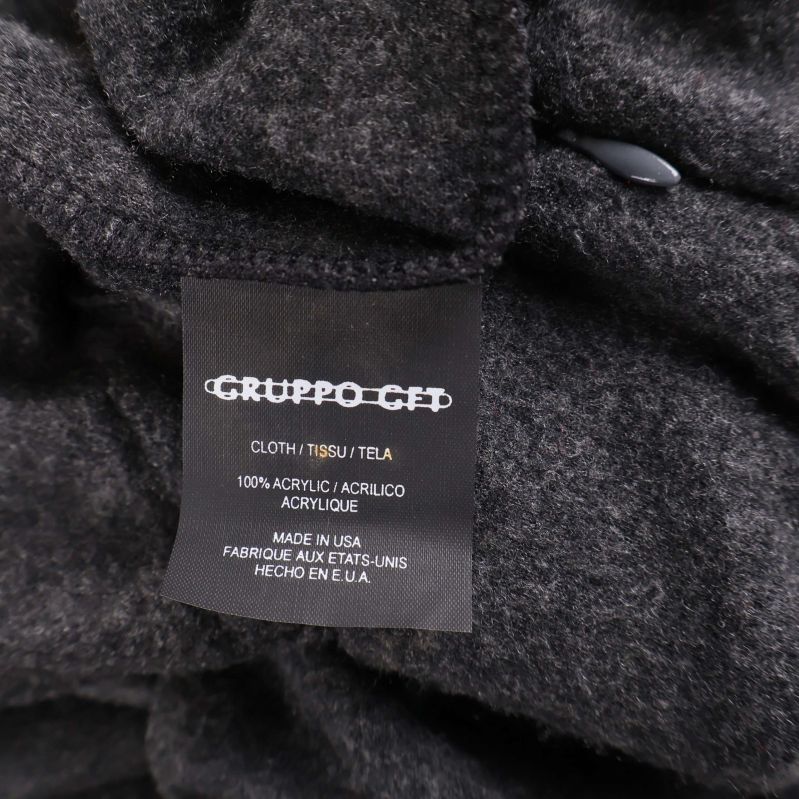 Materialetikett som anger 100% akryl