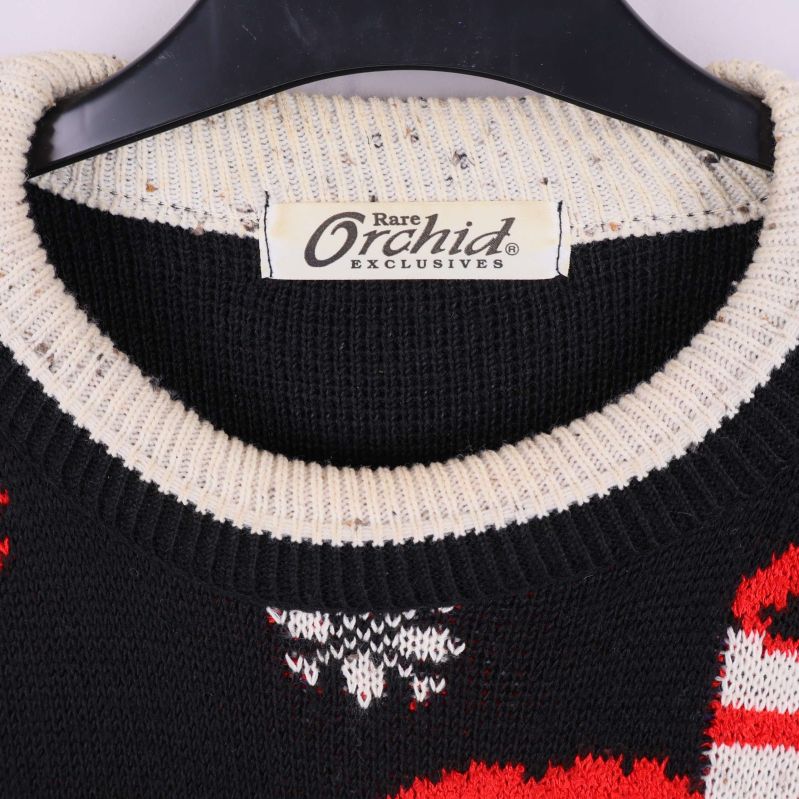 Närbild på Rare Orchid märkesskylt och vit ribbkrage