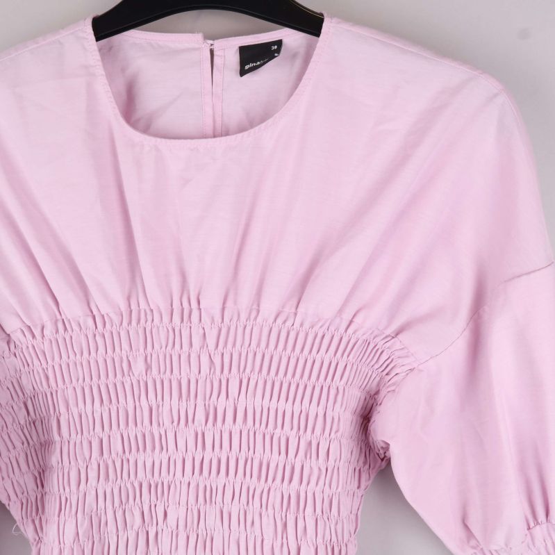 Närbild på smockdetalj