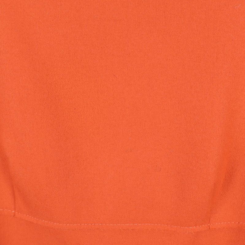 Närbild på slät orange textil utan mönster