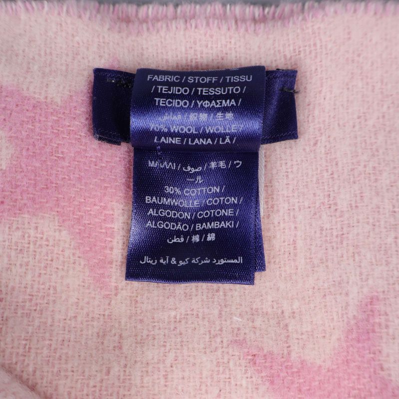 Materialetikett med innehåll i ull och bomull