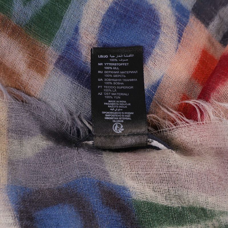 Materiallapp visar 100 procent ull på sjal