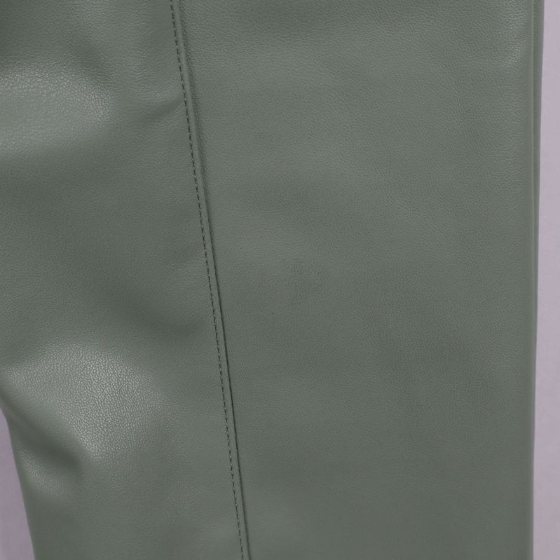 Närbild på grön fuskläderstruktur