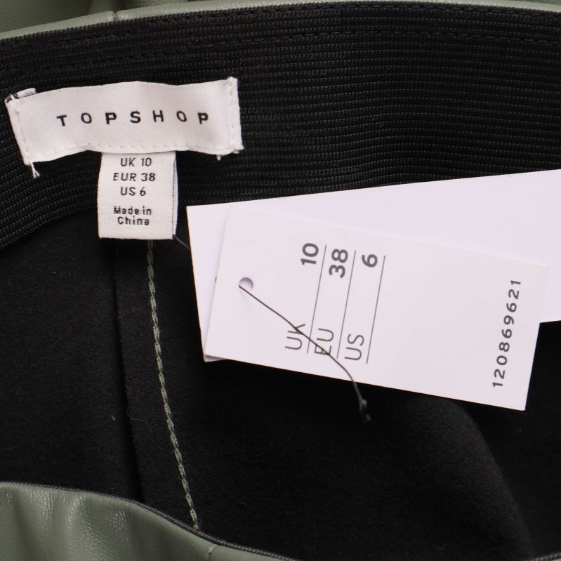 Topshop-etikett och storlekslapp på insidan