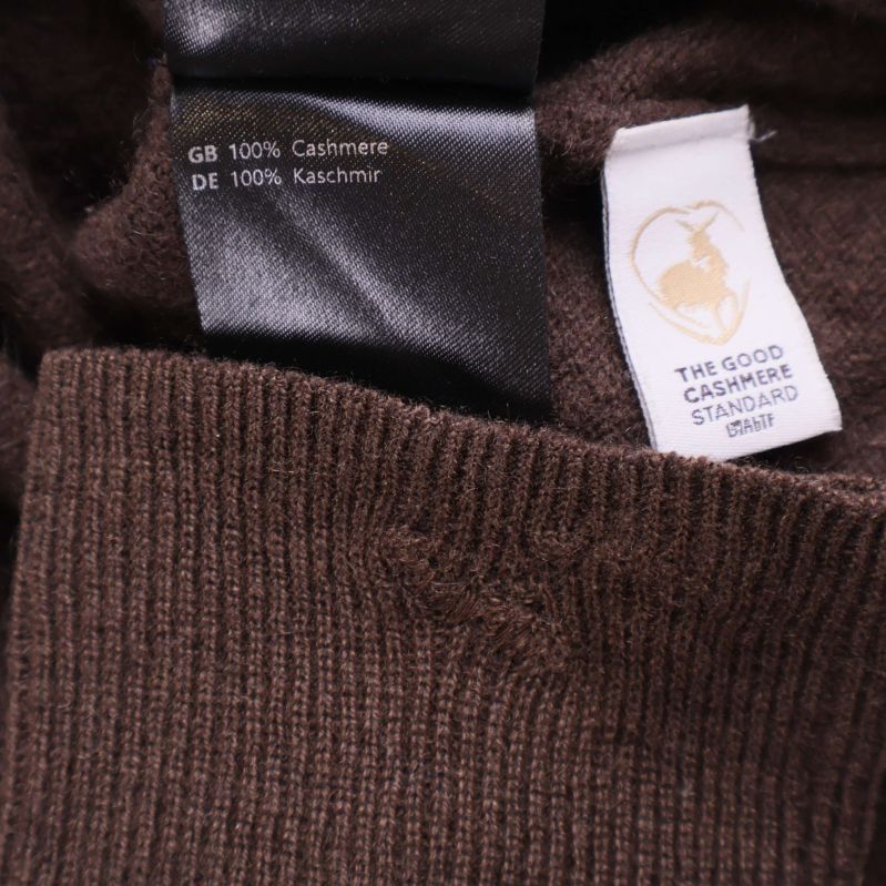 Materialetikett med 100 procent kashmir och certifieringsmärke