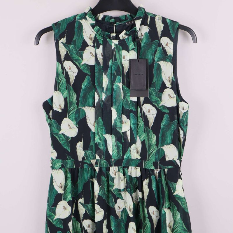 Övre del av klänning med knytning och bladmönster