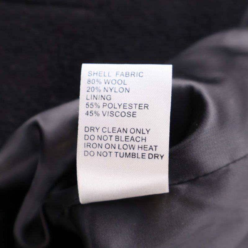 Materiallapp som visar materialinnehåll på kappan