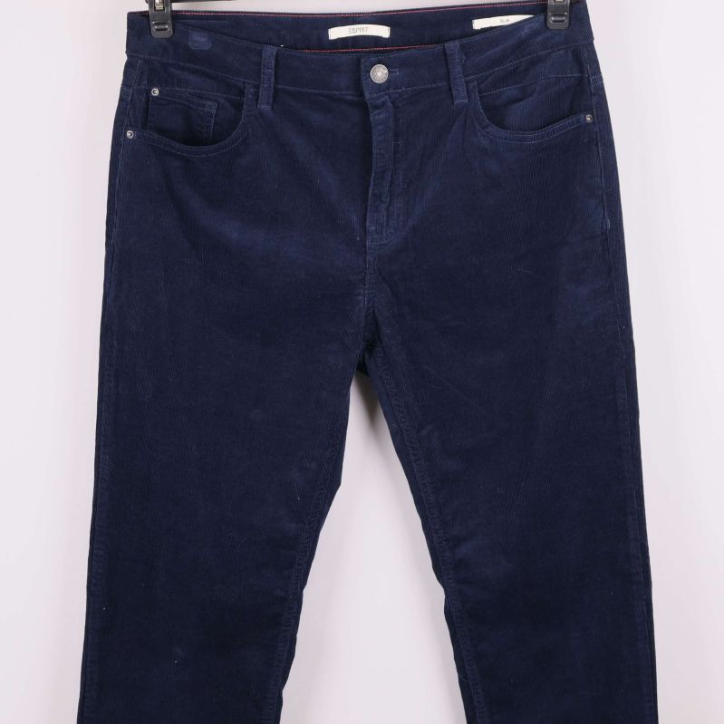 Överdel av blå manchesterbyxa med fickor och knapp