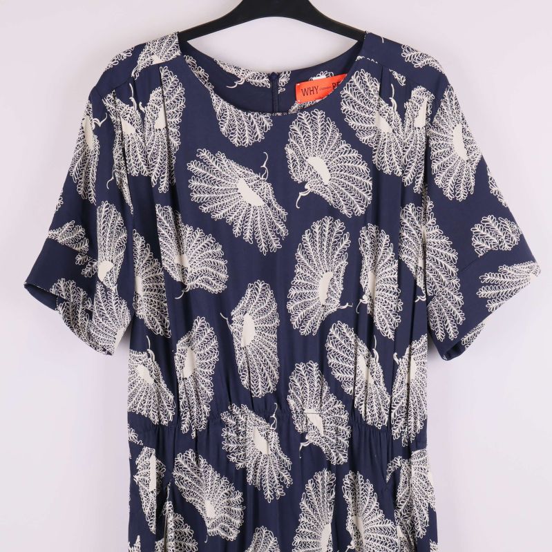 Överdel av klänning med lövliknande vitt mönster