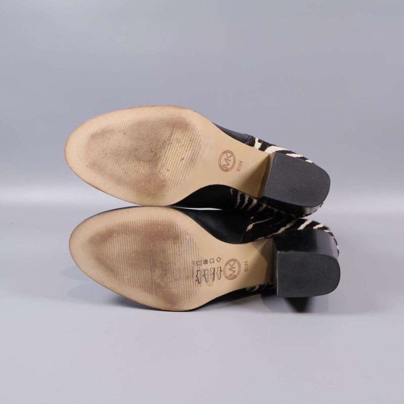 Boots sula i närbild med viss användning och logotyp