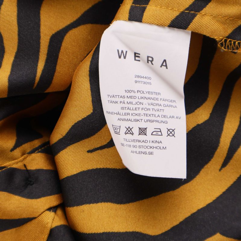 Materiallapp med information om 100% polyester