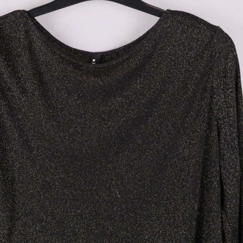 Närbild på materialstruktur och glittrig yta