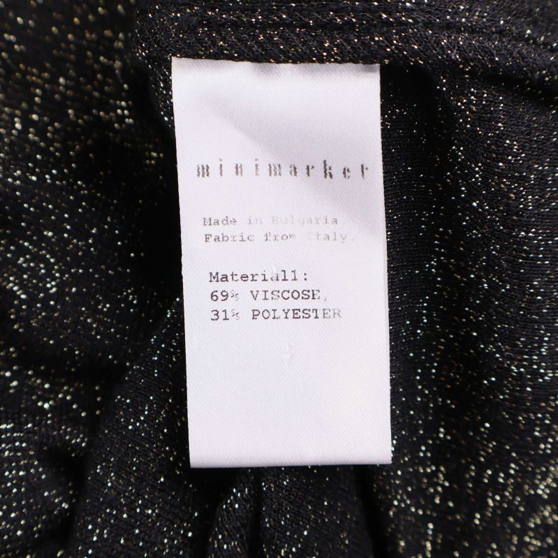 Materiallapp visar 69% viskos 31% polyester